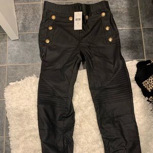 Black leggings with gold buttons